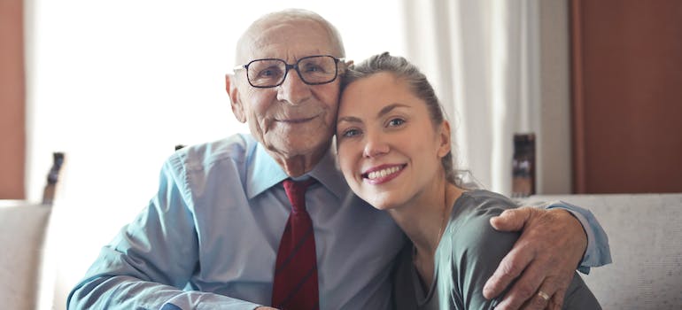 grandfather and granddaughter hugging after talking about how to ease anxiety on moving day