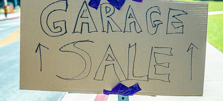 garage sale cardboard sign