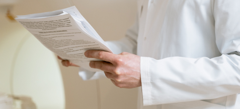 Medical worker holding documents