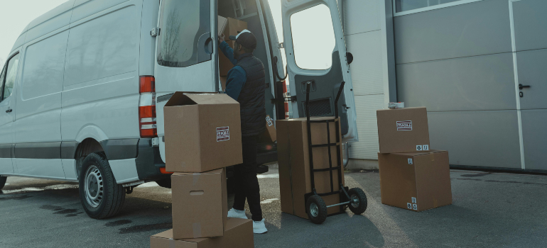 guy loading boxes into a van