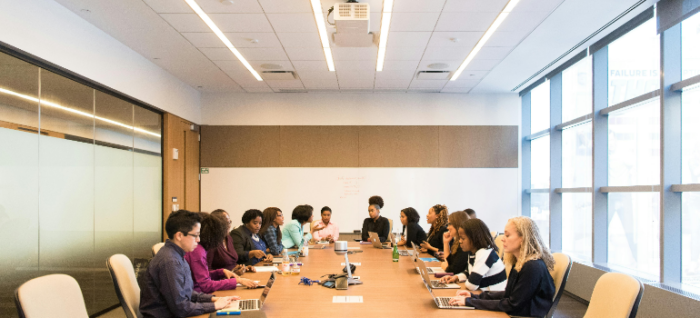 a group of people in a meeting 