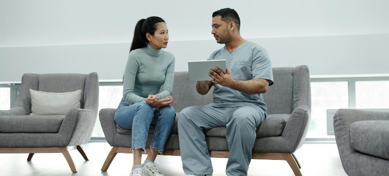 patient talking to a doctor about healthcare relocations for international relocation