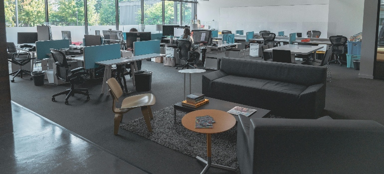 an office with grey couches 