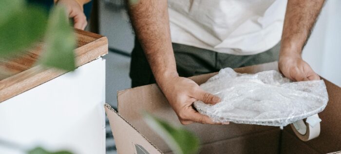 a person packing a plate 