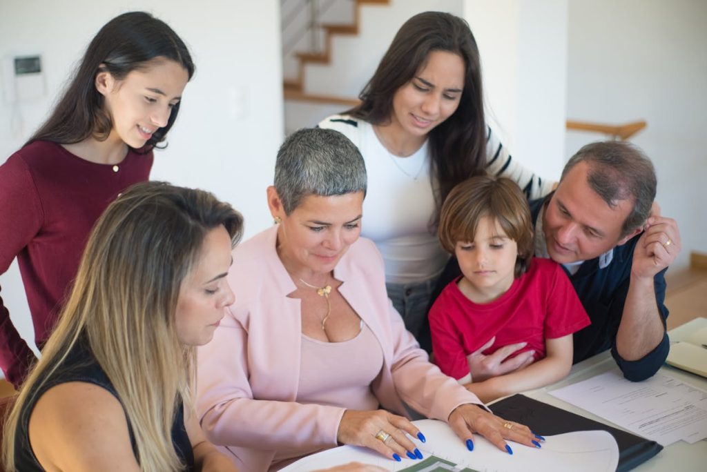 A family talking with the moving company representative about kid-friendly unpacking