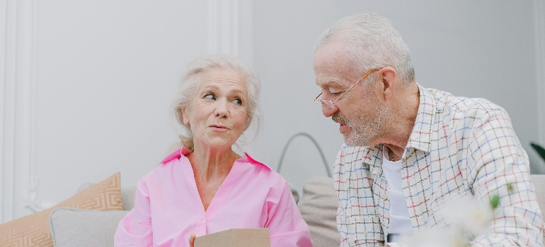 An elderly couple talking