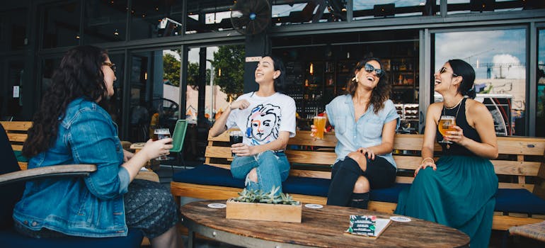 friends talking while having drinks