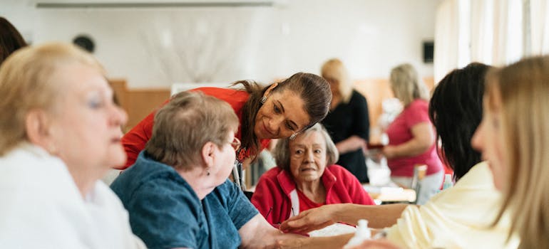 Woman talking to seniors