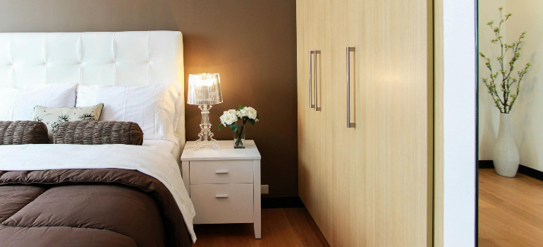 nightstand next to a bed