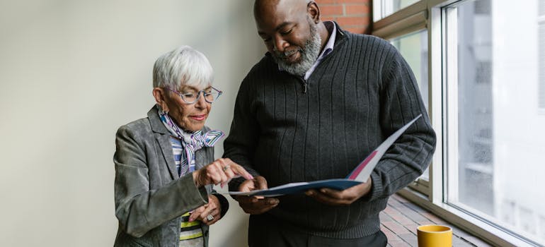 A man and woman talking about how to minimize the impact relocation has on seniors