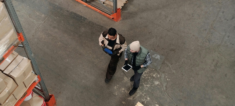 two men in a warehouse talking about the Types of Storage Available to Business