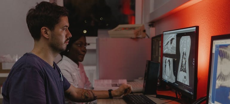 two doctors looking at x-rays 