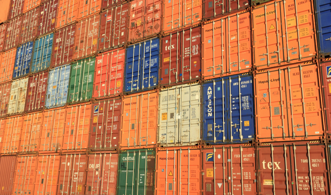 tacked shipping containers in various colors.