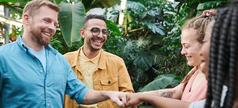 Four employees laughing.