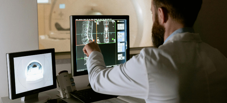 doctor pointing at a computer screen
