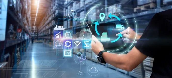 Man hands using tablet on blurred warehouse as background
